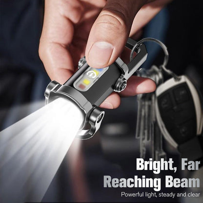 🥳2026 HOT SALE🥳💞50K+ SOLD! 🔦💡 50% OFF! Keychain Flashlight – LED+COB dual light, 7 modes for every need. Ultra-light 29g – clip it on your keys or jacket. Never be caught in the dark again – safe walks, every time! 🚶✅